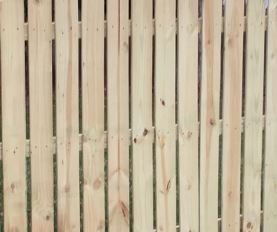 Close-up of a wooden fence with vertical planks.